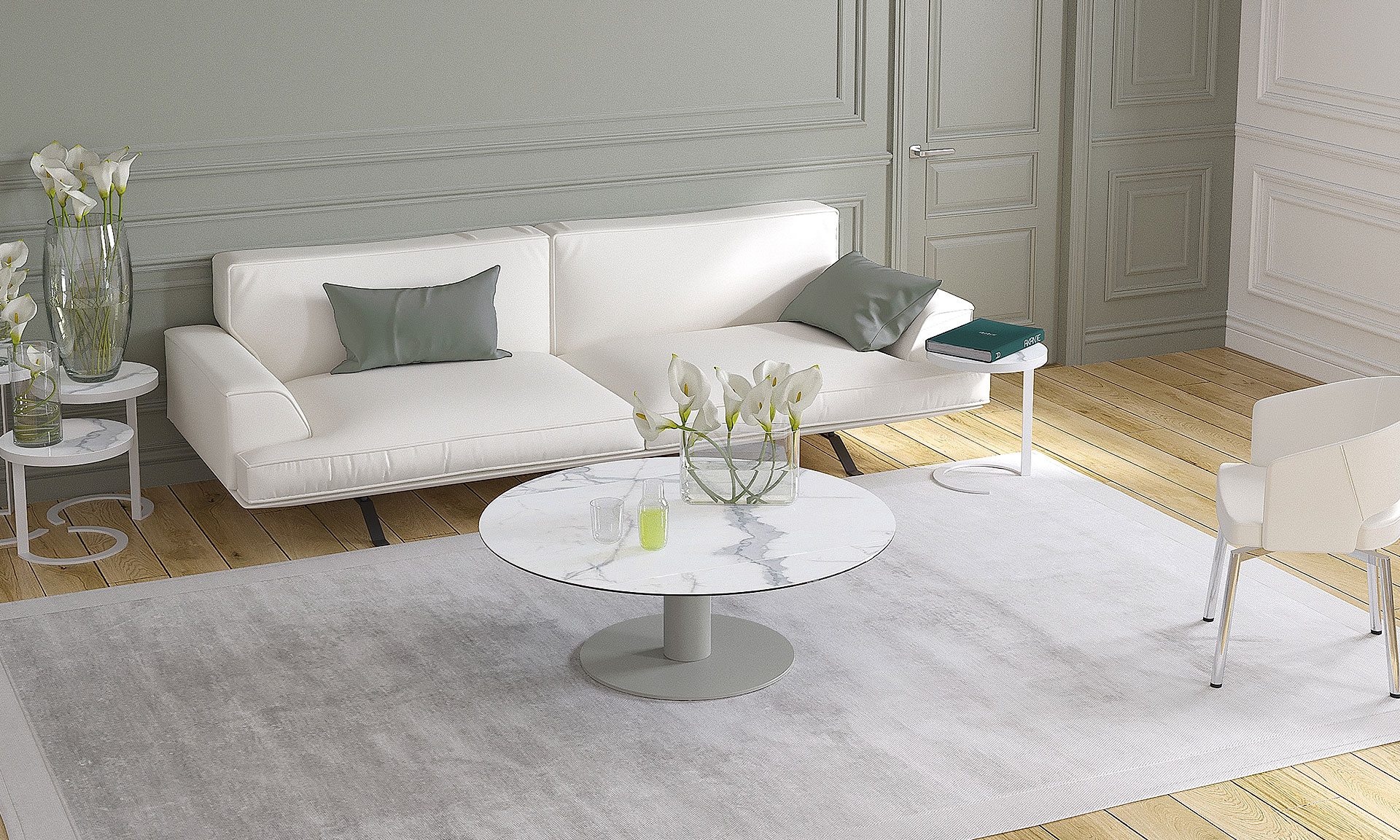 Photo d'une salon avec une table basse. Elle à une finition en céramique effet marbre blanc et des piétements en métal gris.